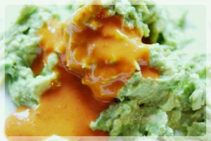 Mashed Avacado, green peas, lime juice and Nandoos Sauce for Avocado Eggs at your food fantasy | YourFoodFantasy.com